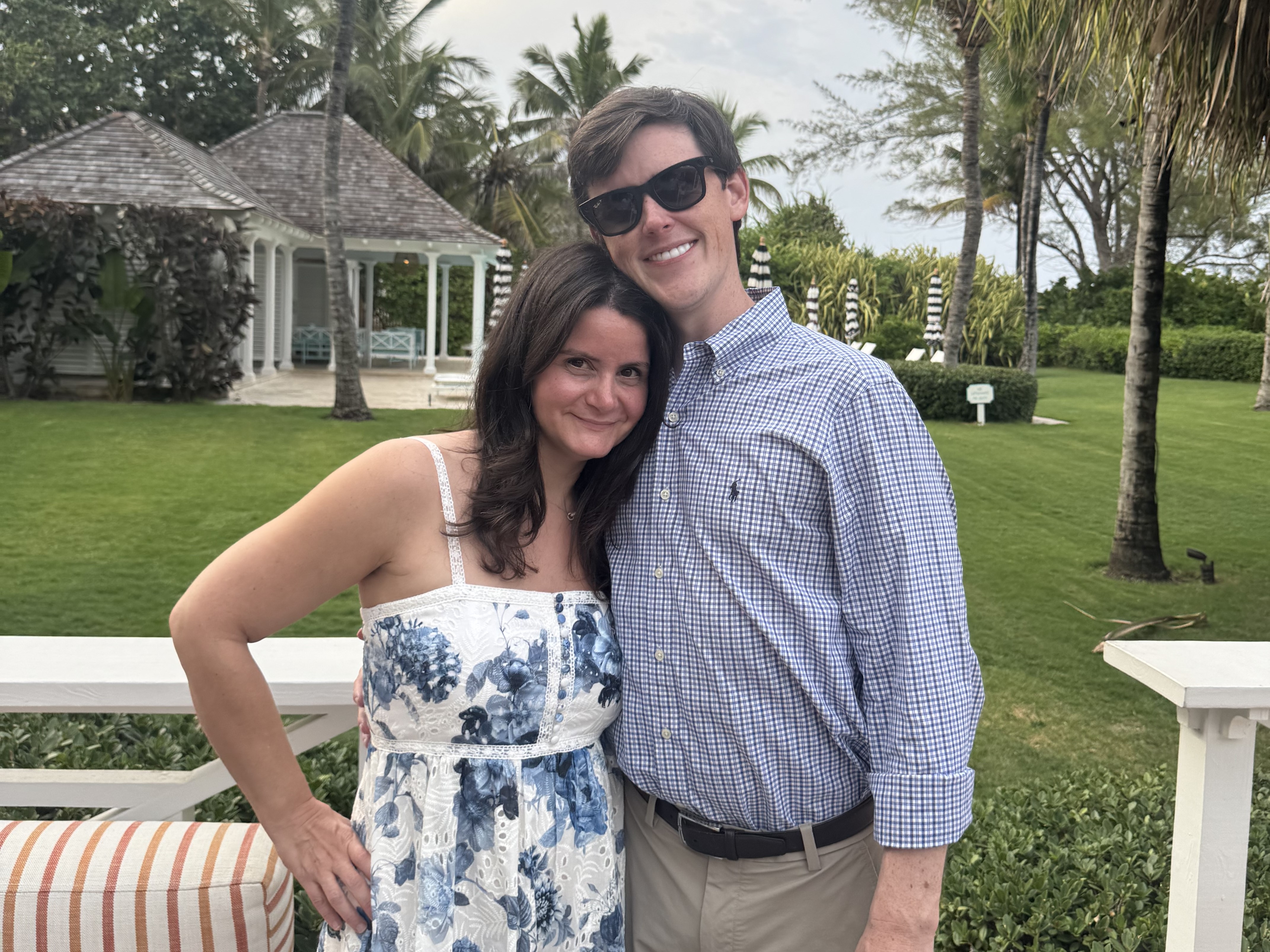 Jenna and Alex smiling together outdoors, engagement photo